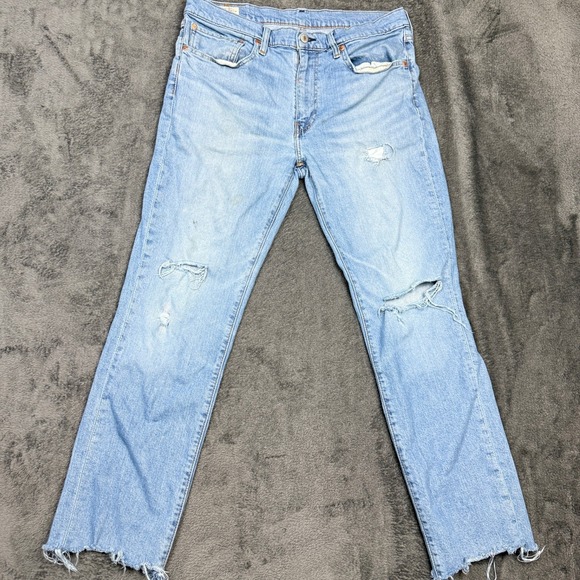 Levis Premium Light Wash Distressed Jeans Rips Frayed Hem Mens Denim Pants - Picture 1 of 13